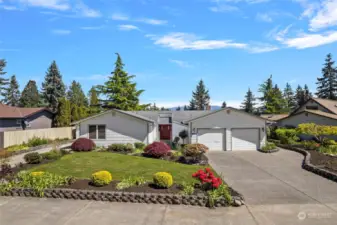 Fantastic street appeal welcomes you into this charming rambler on the 1st hole of the Burlington Golf and Country Club!  Stunning golf, mountain and territorial views abound!