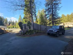 2 Main entry gated entries - the one on the left being for the detached  shop, the one on the right for the home.  a 3rd gated/service entry is to the rear of the home.