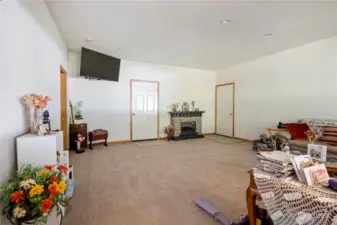 Bonus room adjacent to the kitchen - with a half bath.