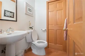 Powder room directly off of the kitchen.