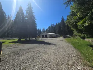 A comfortable distance away is the 4,000 square foot shop with its own entrance, electricity, heat, plumbing/bathroom AND laundry. GREAT option for an income generating business/rental.