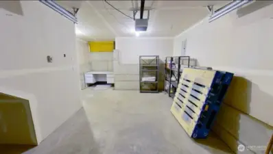 Photo of lower level fully finished secure private garage and storage.