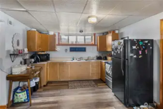 functional kitchen with sleek finishes, ample space, and a welcoming atmosphere—perfect for cooking