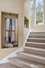 This home features double stairways - one to the Primary suite and one to the 3 bedroom and bonus room North wing or children's wing.