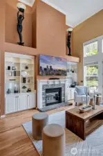 Two story, light filled family room, graced with a fireplace and built-ins.  French doors to the backyard.
