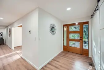 Walk in to an open floor plan and new flooring