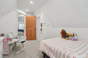 One of two second floor bedrooms