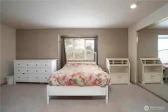 King-size primary bedroom has enough space for larger furniture.