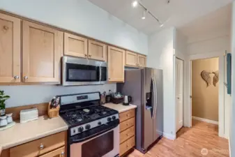 Stainless steel GE microwave, gas range top/oven, refrigerator and dishwasher stay with the home.