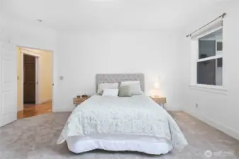 Main level primary bedroom suite.
