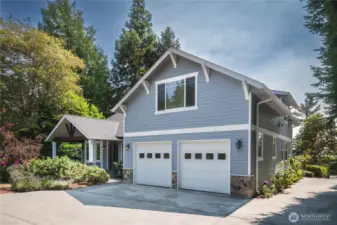 Back of the home with two car garage.