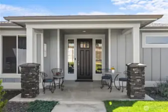 Welcoming front porch! Also provides a cool  respite from afternoon sun in late  summertime.