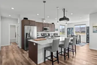 Wide hallways, plentiful windows, great  lighting, gorgeous LVP floors!