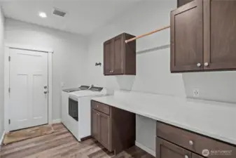 Massive laundry room will come in handy!  Love all the counter & cabinet space!