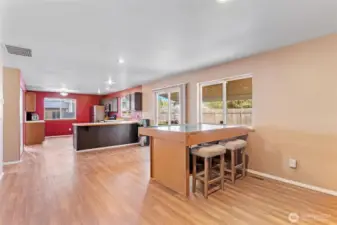 Large living room with gas fireplace and spacious kitchen