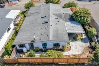 Aerial view of the back of the home. Back and side yards are fenced. Great place for Fido to safely run and play.