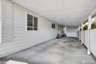 Oversized, private carport area. Double sided stairs to the utility room access door into the home. You are covered from the weather when unloading groceries etc.