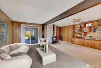 Formal living room area has beamed ceiling, Built in book shelves or curio display area. Free Standing propane stove for those chilly Washington days! You can bring all your furniture and collectibles as there is room for EVERYTHING! No downsizing to live here.