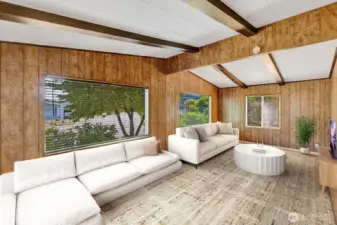 Family room has notable natural lighting. Custom plantation blinds on the vinyl windows. Great space for relaxing, or entertaining. Easy care laminate flooring for your convenience.