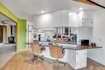 Breakfast bar area with custom chairs. Built in computer station with storage cabinet that is so convenient.