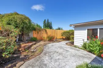 View of the cement sidewalk and easy-care yard.