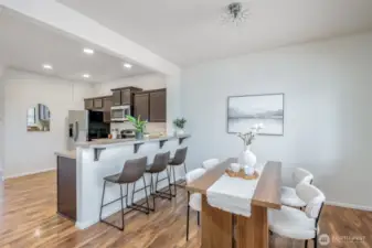 Dining Room And Kitchen W/ A Stooled Countertop For 3