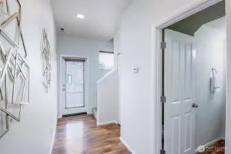 Hallway To Half Bath, Stairs To 2nd Level And Door To Fully Fenced Backyard