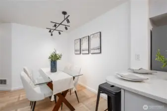 Dining room fits a real table as well as two bar stools.