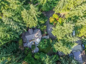 Surrounded by evergreens and tucked behind a gate with a loop driveway this property is the ultimate Pacific Northwest Retreat. With a 40’x48’ shop, 3,200 sqft House, Nature Trail, and entertainment space galore.