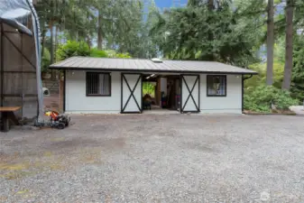 Barn building with a single stall and a workshop. Water and power to barn building.