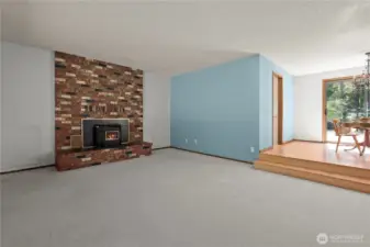 A lovely brick fireplace is central to the home, with an easy to use pellet stove.