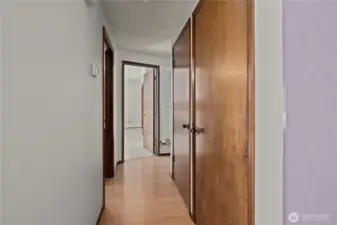 Hallway leading to the three bedrooms.