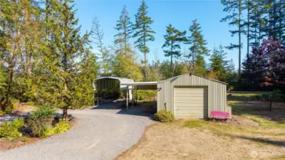 Incredible detached shop, as well as a carport and RV carport.
