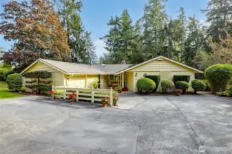 Yes, it's really that cute. Plenty of parking, covered front porch area, single car garage, mature landscaping, and privacy.