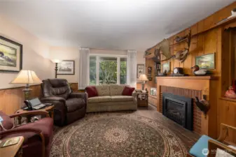Cozy doesn't do it justice...grab your tea and a blanket and settle in.  The brick floor and knotty pine wall underscore the casual comfort of the den/family room.