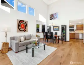 Spacious and open, the heart of the home blends dining and gathering under dramatic vaulted ceilings