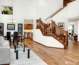 A striking grand staircase sets the tone for elegant living