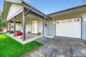 Beautiful covered front porch area to welcome you home and unwind after a long day.