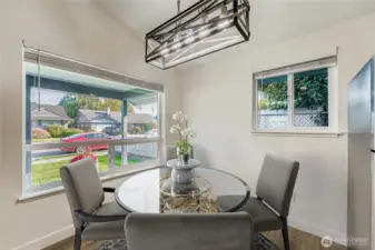 Virtually staged. Perfect dining space right next to the kitchen.