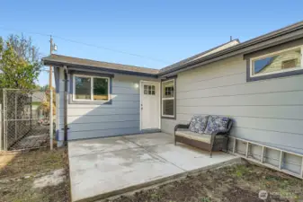 Large patio off the back of the home. Perfect size for a BBQ and table to make dinner and enjoy your own space.