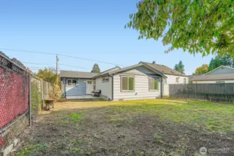 View from shed in the backyard. As you can see, this landscape is waiting for your ideas! Add a garden, a playset, a trampoline or pool - the options are endless.