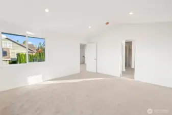 Primary suite reverse angle toward bathroom and walk in closet