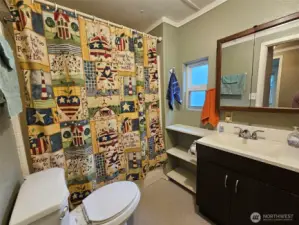 Lots of storage in this full bathroom.