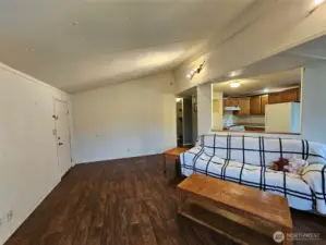 Put your tv om the wall to watch from the couch and kitchen.