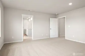 Primary Bedroom. Photos of previously built home of same floorplan. Colors, Specifications, and Options may vary on actual home.