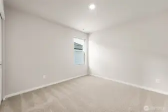 Guest Bedroom. Photos of previously built home of same floorplan. Colors, Specifications, and Options may vary on actual home.