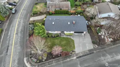 Bird’s-eye view showcasing prime corner-lot location & mature landscaping.