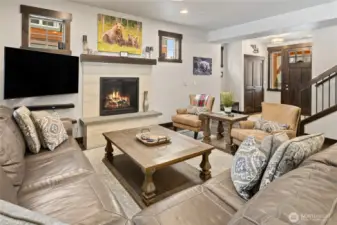 Warm and cozy living area with gas fireplace. Home has 5 TV's Internet is great!