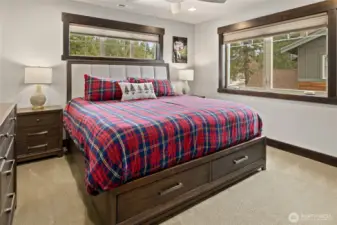 3rd bedroom with King Bed and ceiling fan, TV and full bathroom