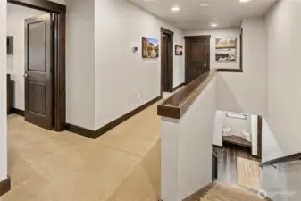 Upstairs hall. Custom photos throughout the home.